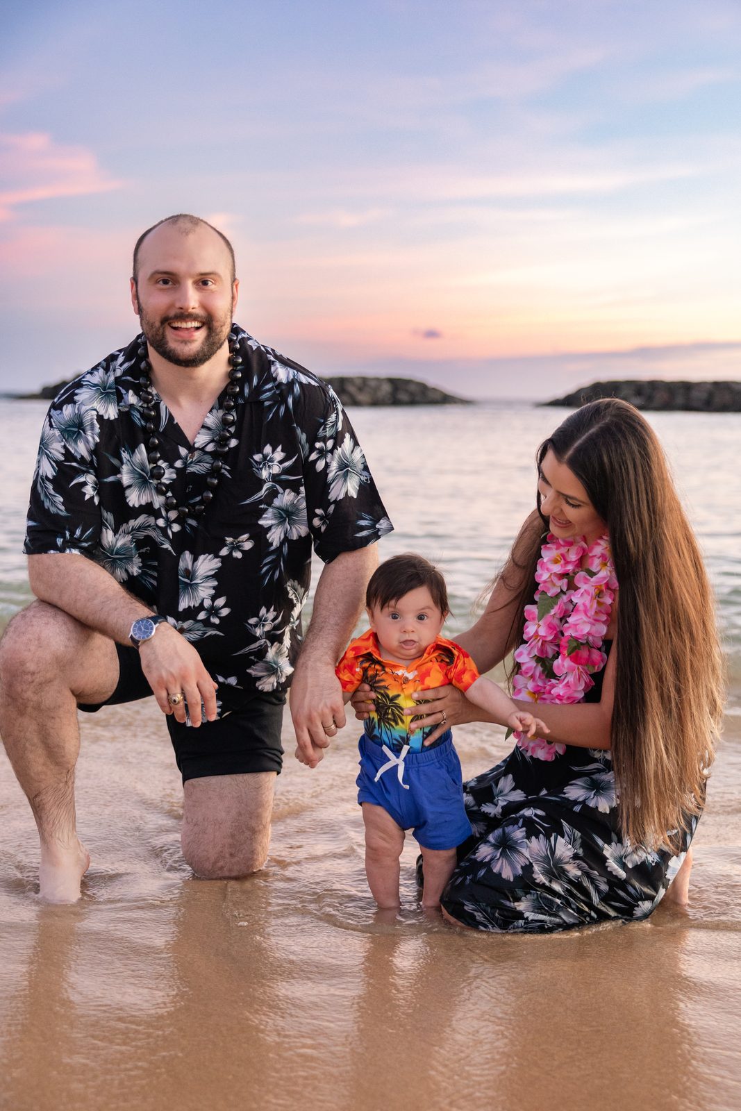 Andrew with his family on a beach in Hawaii