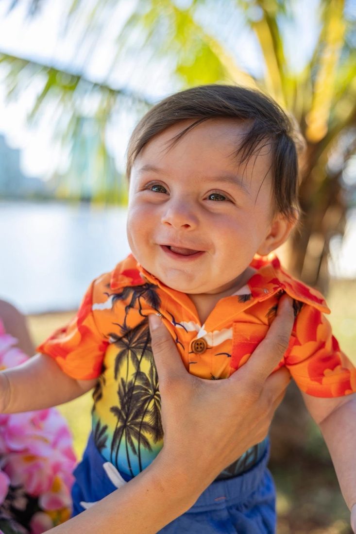 Charlie smiling outdoors in Hawaii