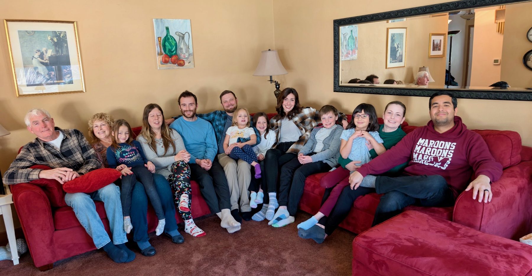 The extended family gathered together on the couch